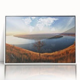 Acrylic print of a European landscape in muted greens and blues, framed in white, suitable for modern art wall decor.