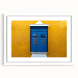 Abstract art print of Yucatan scenery in muted earth tones on a framed white mat, suitable for dining room decor.