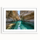 Abstract art print of a Middle Eastern landscape in muted earth tones on a white framed canvas, ideal for dining room decor.