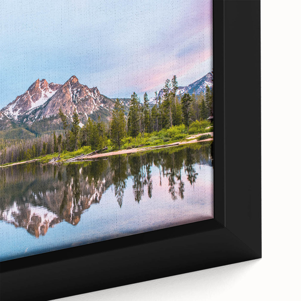 Close-up of a black framed canvas featuring a textured, colorful Idaho scenery, ideal for living room decor.