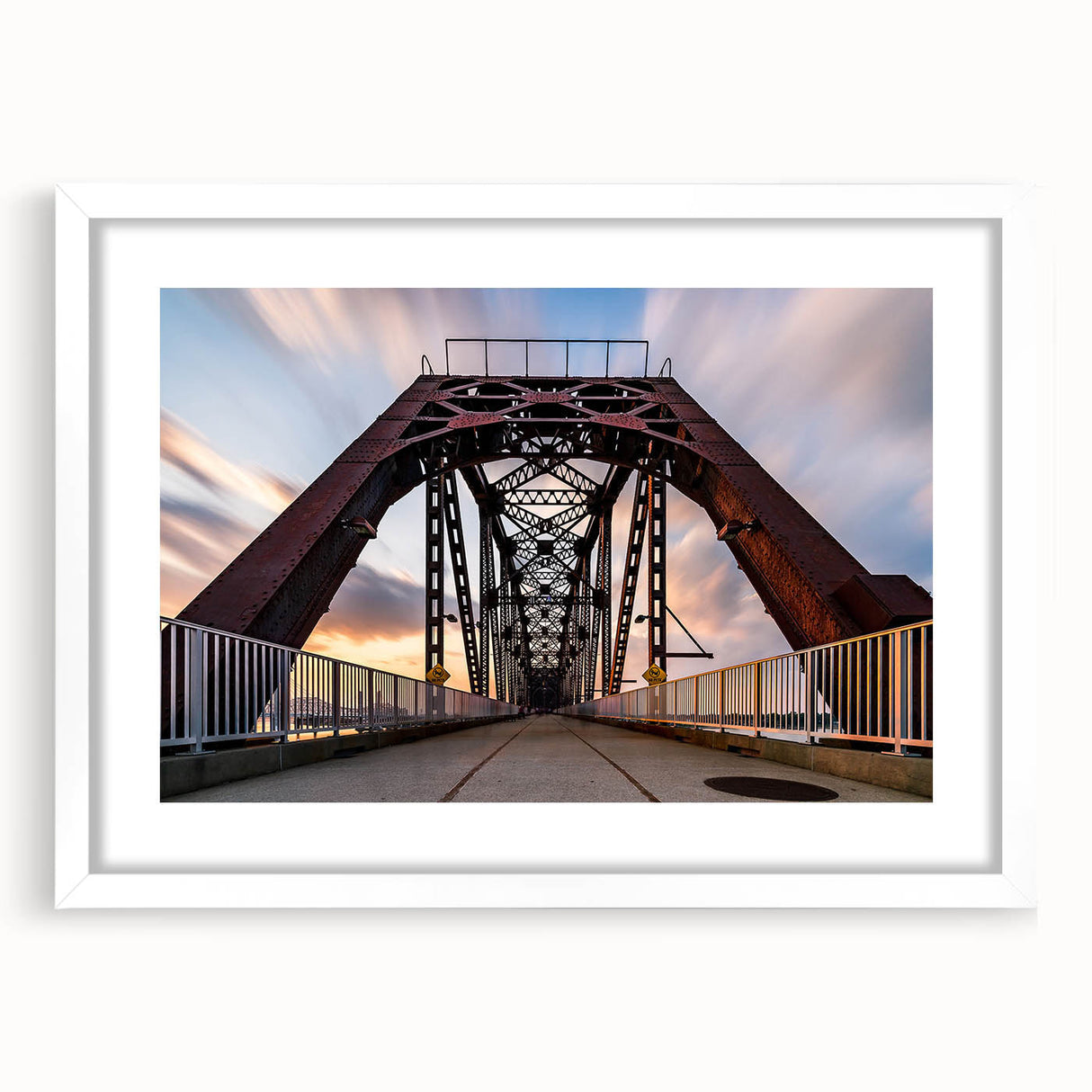 Abstract art print of Kentucky scenery in muted green and blue tones, framed with a white mat.