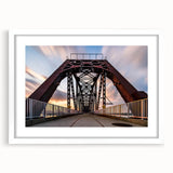 Abstract art print of Kentucky scenery in muted green and blue tones, framed with a white mat.