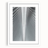 Abstract art print of Seattle skyline in muted gray and blue tones on a framed white mat.