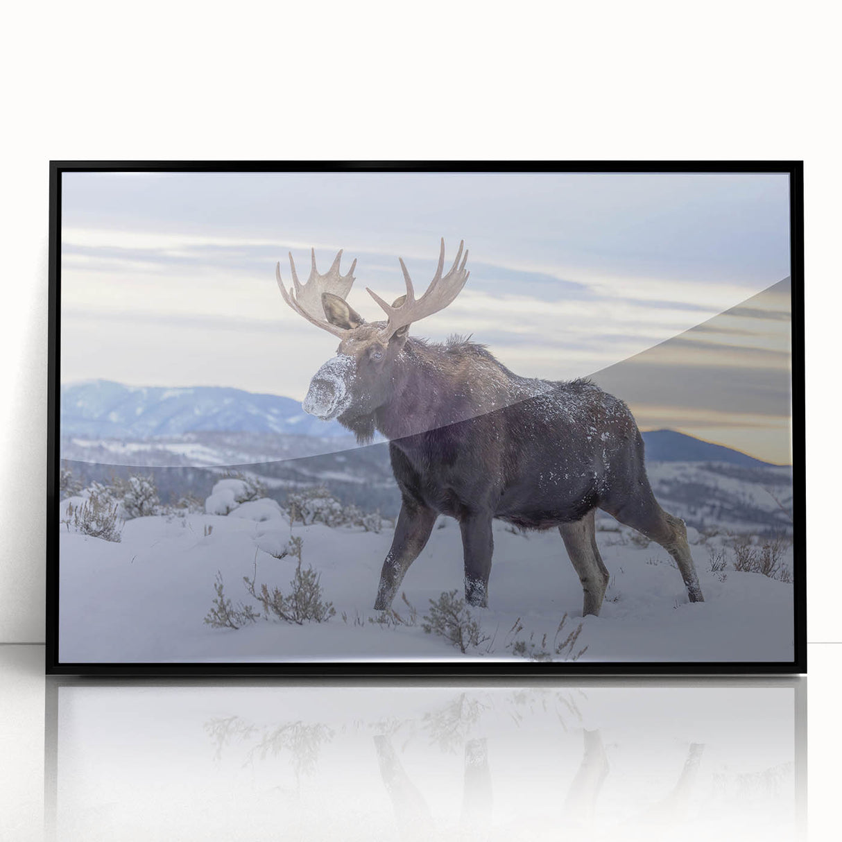 Large abstract wall art depicting the Grand Tetons, in a mid-century modernist style with a framed acrylic in black.