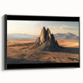 Framed canvas artwork depicting a desert landscape with warm hues of orange and yellow, showcasing a serene sunset view against a black frame. Perfect for home decor.