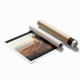 Desert landscape rolled print showcasing vibrant orange and golden hues, capturing the serene beauty of arid terrain, neatly packaged in a protective cardboard tube.