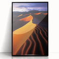 Framed acrylic art print showcasing a serene landscape with rolling sand dunes, presented in a sleek black frame, perfect for modern home decor.