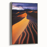 Framed canvas artwork showcasing serene sand dunes in a minimalist design, featuring a sleek silver frame. Perfect for modern decor or nature-themed interiors.