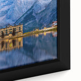 Close-up of a textured black wall art depicting a European scenery in vibrant colors on a framed canvas.