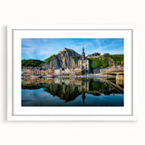 Textured abstract art print depicting a European scenery, in muted earth tones, framed with a white mat.