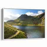 Vintage poster art of Cumbria, England, displayed in a white-framed canvas, featuring colorful imagery.