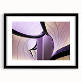 Colorful abstract art print of London scenery in vibrant hues on a large, textured canvas, framed in black.
