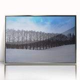 Large art print of a serene European Estonian landscape in muted green and blue tones, framed in silver acrylic.