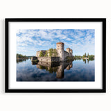 Extra large abstract art print of a colorful, textured Finnish landscape in a black frame, ideal for living room decor.