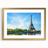 Abstract art print of Paris scenery in muted gold and blue tones, framed with a gold mat, suitable for dining room decor.