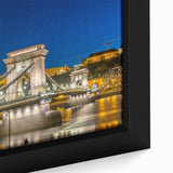 Extra large framed canvas featuring a textured depiction of a European cityscape in black with colorful accents.