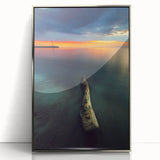 Large art print of a serene Lithuanian landscape in muted green and blue tones, framed in silver acrylic.