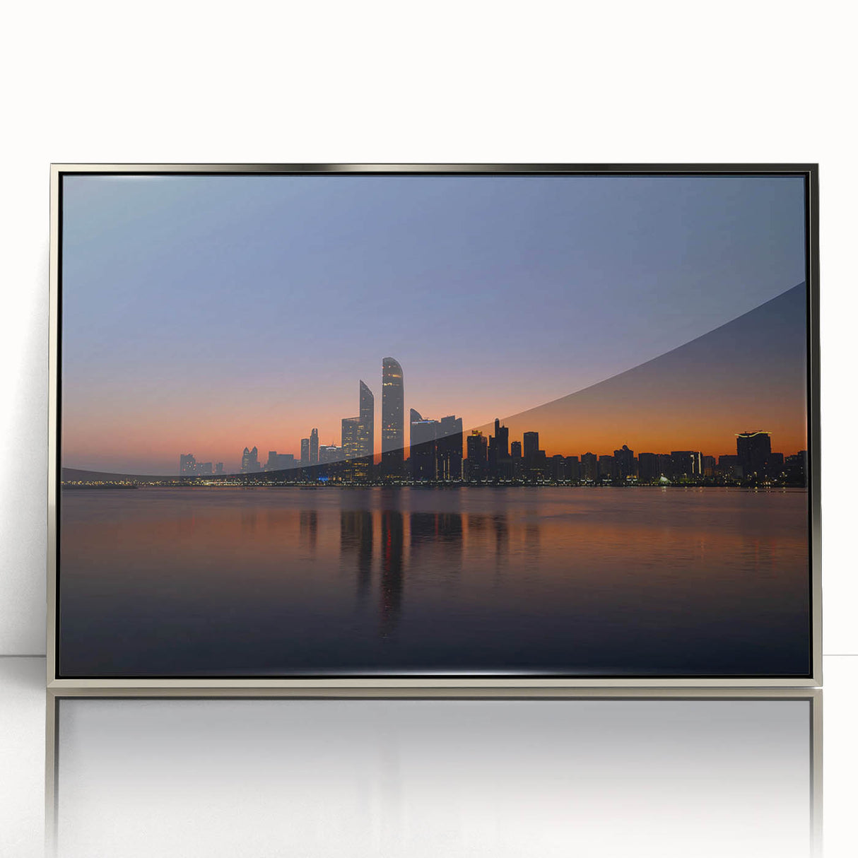 Mid-century modernist art featuring the Abu Dhabi skyline in muted silver tones on a framed acrylic print.