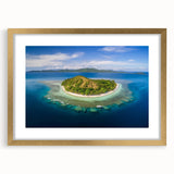 Extra large abstract art print depicting textured oceanic scenery in muted blue and green hues, framed in gold.