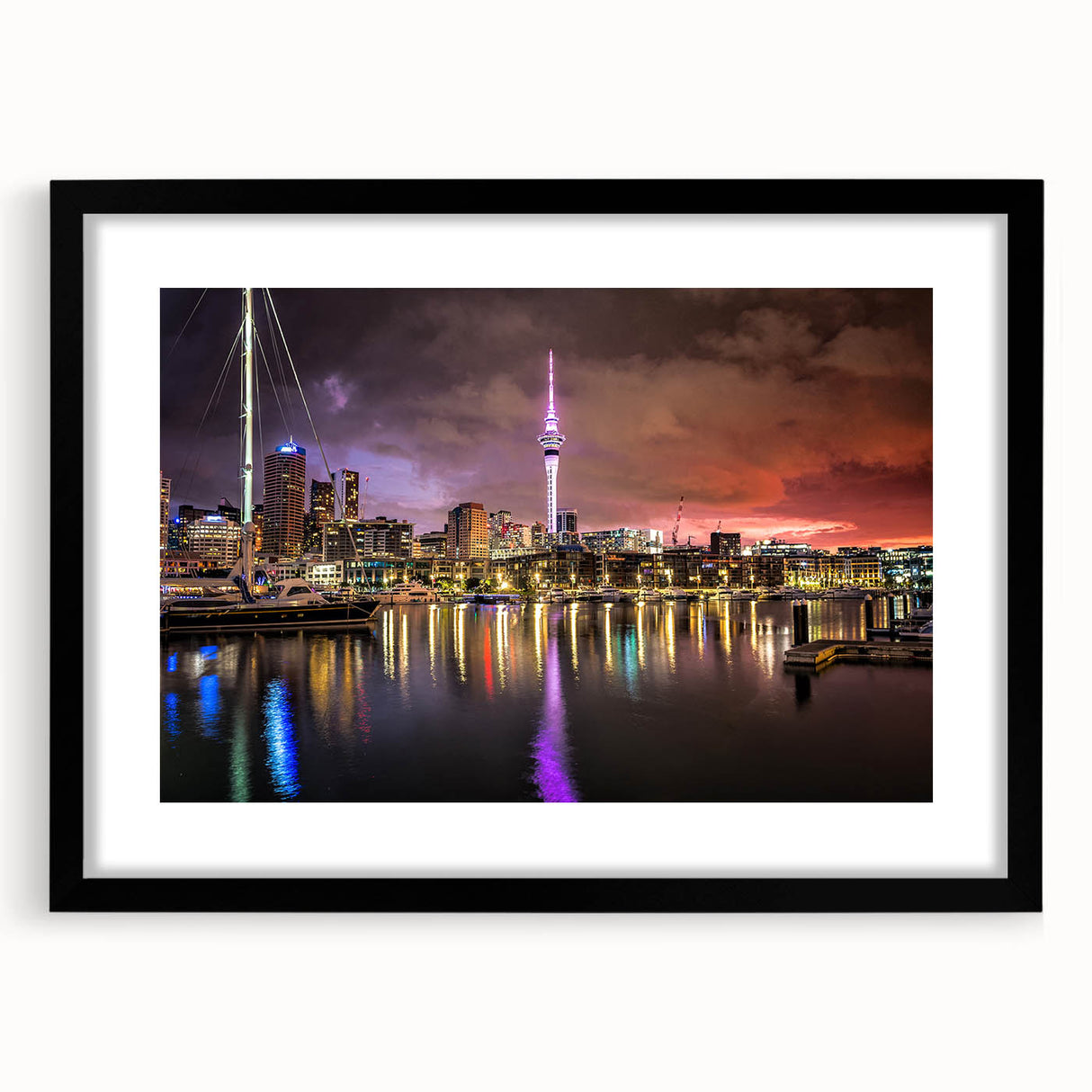 Colorful abstract art print of Auckland scenery on textured canvas, framed in black, ideal for living room decor.