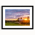 Abstract art print featuring vibrant colors and textured design in a black frame, ideal for living room decor.
