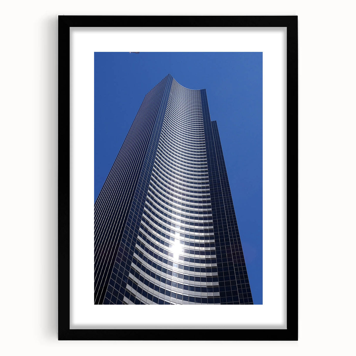 Extra large abstract art print of Seattle skyline in vibrant, colorful hues on a black framed canvas.