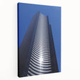Side view of a stretched canvas featuring a detailed Seattle skyline in muted blue and gray tones.