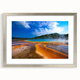 Textured abstract art print depicting Yellowstone scenery in muted earth tones on a silver-framed mat.