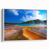Vintage poster art of Yellowstone scenery on a framed canvas, featuring colorful art with black accents.