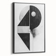 Framed minimalist wall art featuring an abstract black design on canvas, showcased from the side to highlight its sleek profile and modern aesthetic. Perfect for contemporary home decor.