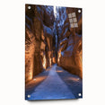 Acrylic glass landscape artwork showcasing a serene cave scene, displayed from a side view with decorative pins, perfect for modern home decor.