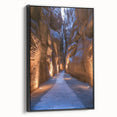 Framed canvas artwork showcasing a stunning landscape with intricate cave formations, designed with a black frame, perfect for enhancing modern home decor.