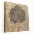 Stretched canvas wall art showcasing vibrant flowers and botanical leaves in a modern design, displayed in a side view to highlight its texture and depth.
