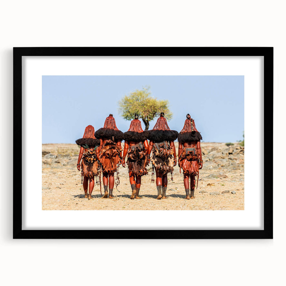 Colorful abstract art print of an African scenery in vibrant hues, textured on a large black framed canvas.