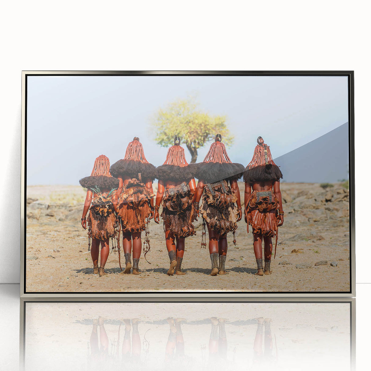Art deco poster of Namibian landscape on silver-framed acrylic, featuring muted earth tones.