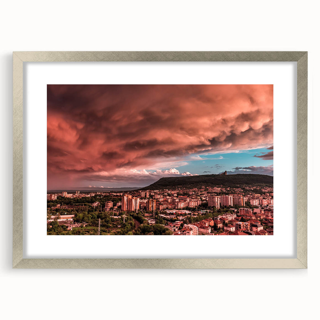 Extra large abstract art print of a European scenery, featuring textured grays and blues, framed in silver.