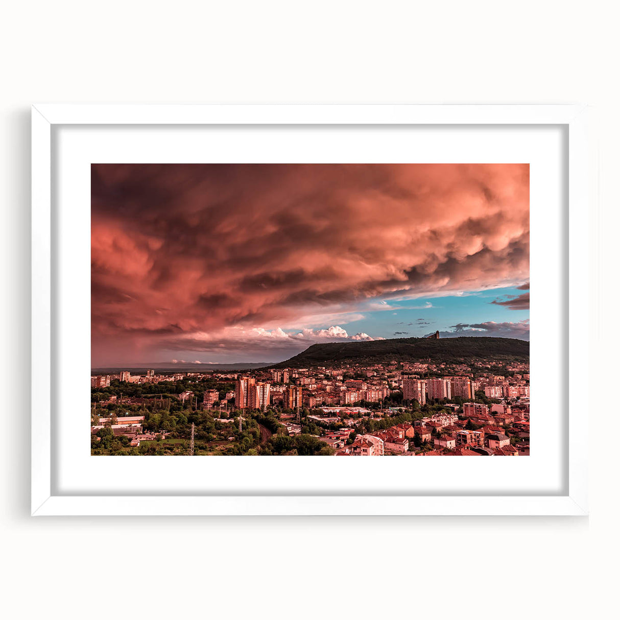 Textured abstract art print of a European scenery in muted earth tones, framed with a white mat, suitable for bedroom decor.
