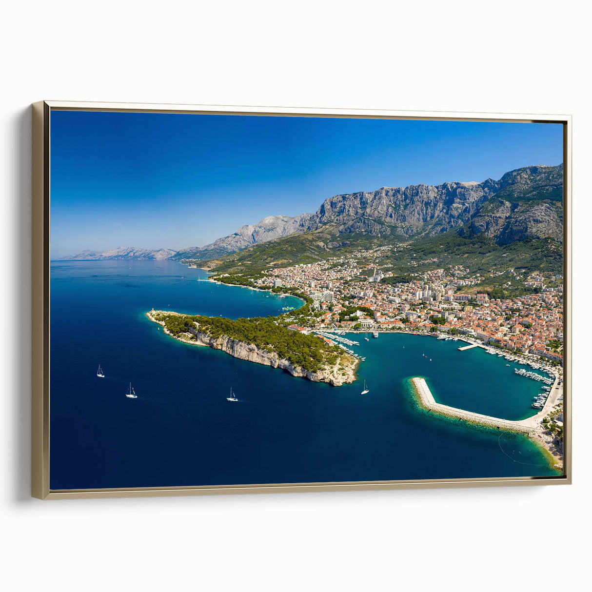 Framed canvas featuring a vintage-style landscape painting of a Croatian scene, with muted earth tones.