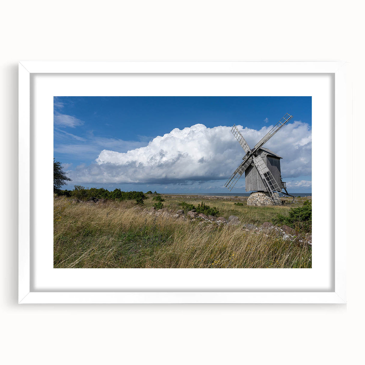 Textured abstract art print of a European scenery in muted earth tones on a framed white mat, ideal for bedroom art.
