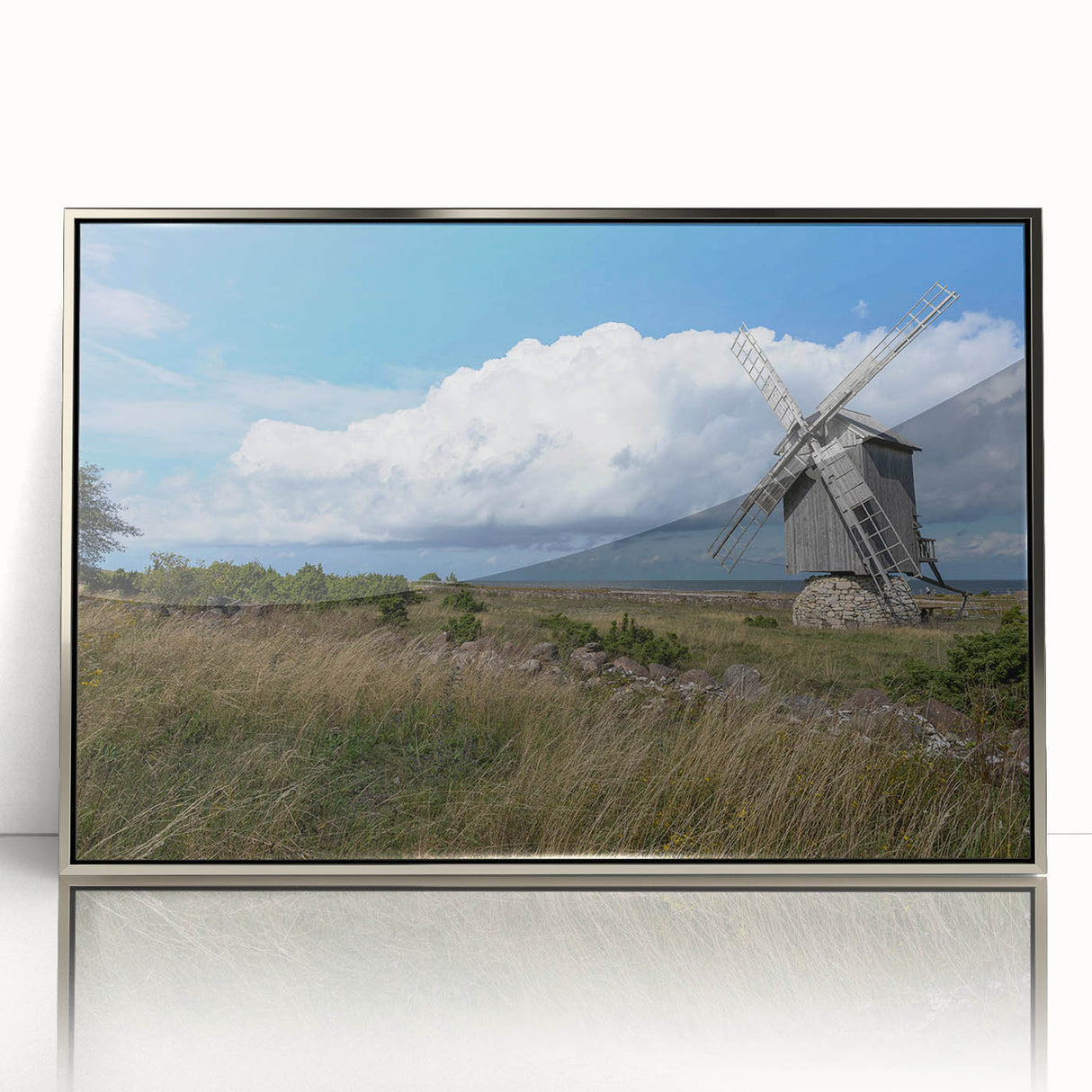 Large art print of a European Estonian scenery in muted earth tones, framed in silver acrylic.