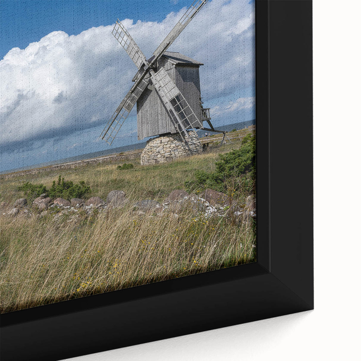 Extra large framed canvas featuring a textured depiction of a European scenery in black with colorful accents.