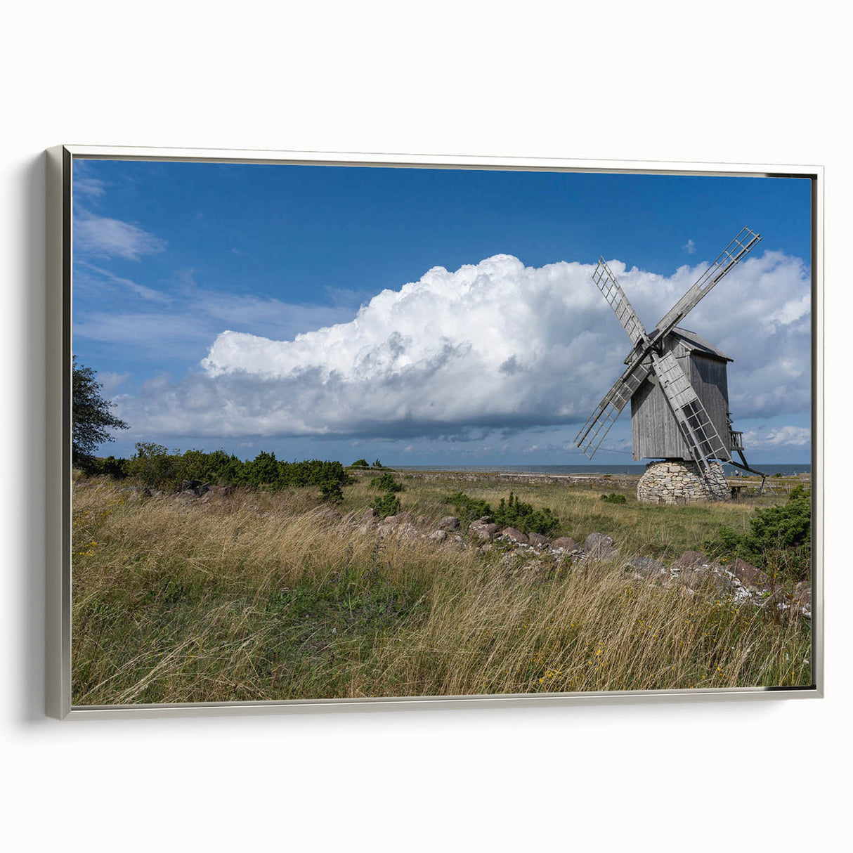 Framed canvas featuring a vintage-style landscape painting of Estonia, with muted earth tones and black accents.