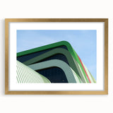 Abstract art print of a European scenery in muted earth tones, framed in gold, suitable for dining room decor.