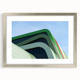 Extra large abstract art print featuring textured scenery of a European landscape in muted earth tones, framed in silver.