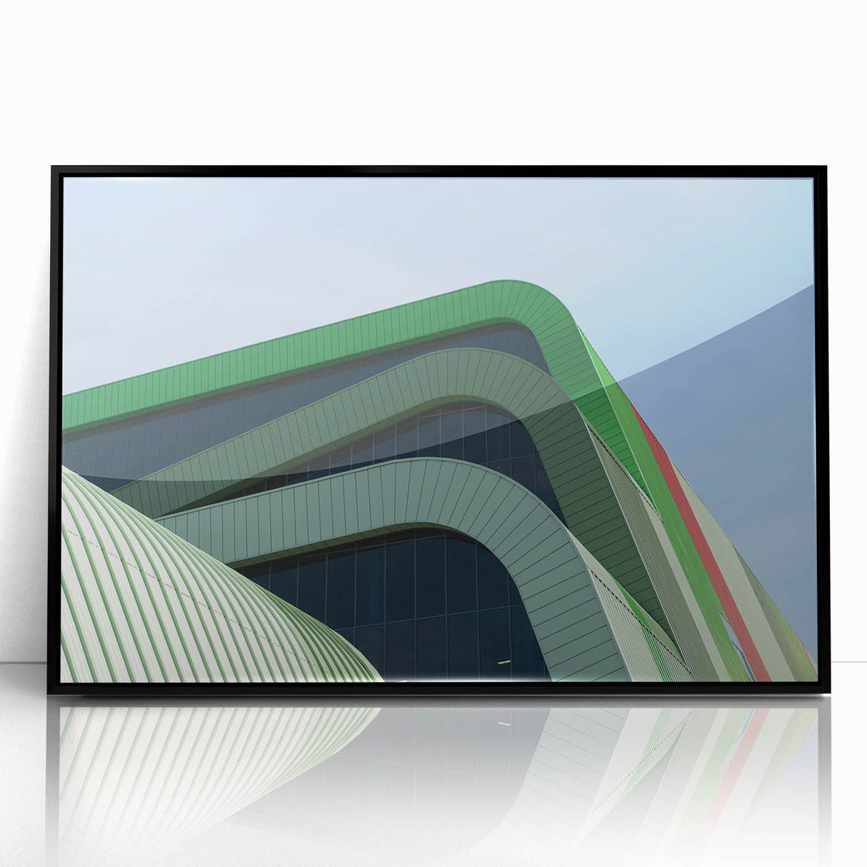 Large abstract wall art depicting a European cityscape in muted gray and blue tones, framed in black acrylic.