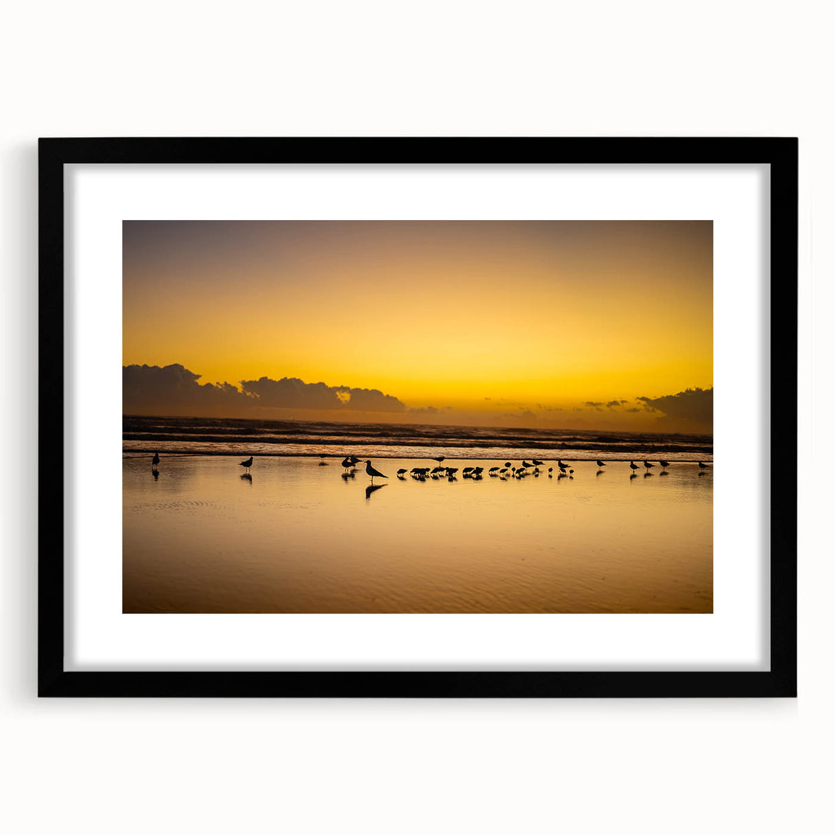 Abstract art print featuring textured, colorful swirls on a large black-framed canvas, ideal for living room decor.