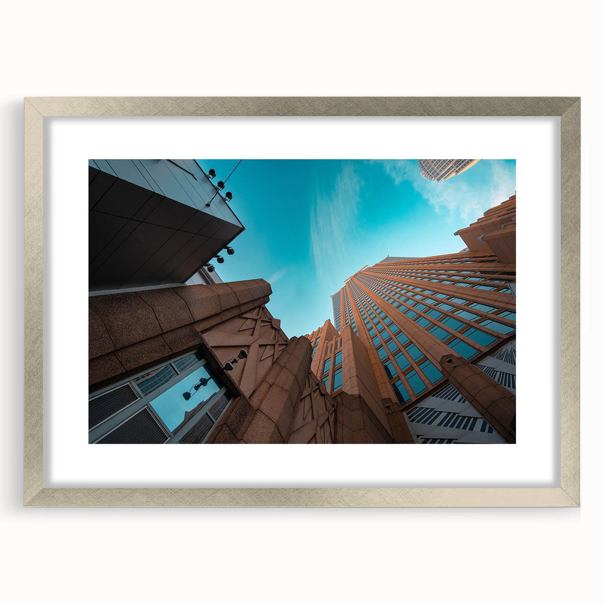 Textured abstract art print of Charlotte skyline in muted gray and blue tones on framed canvas.