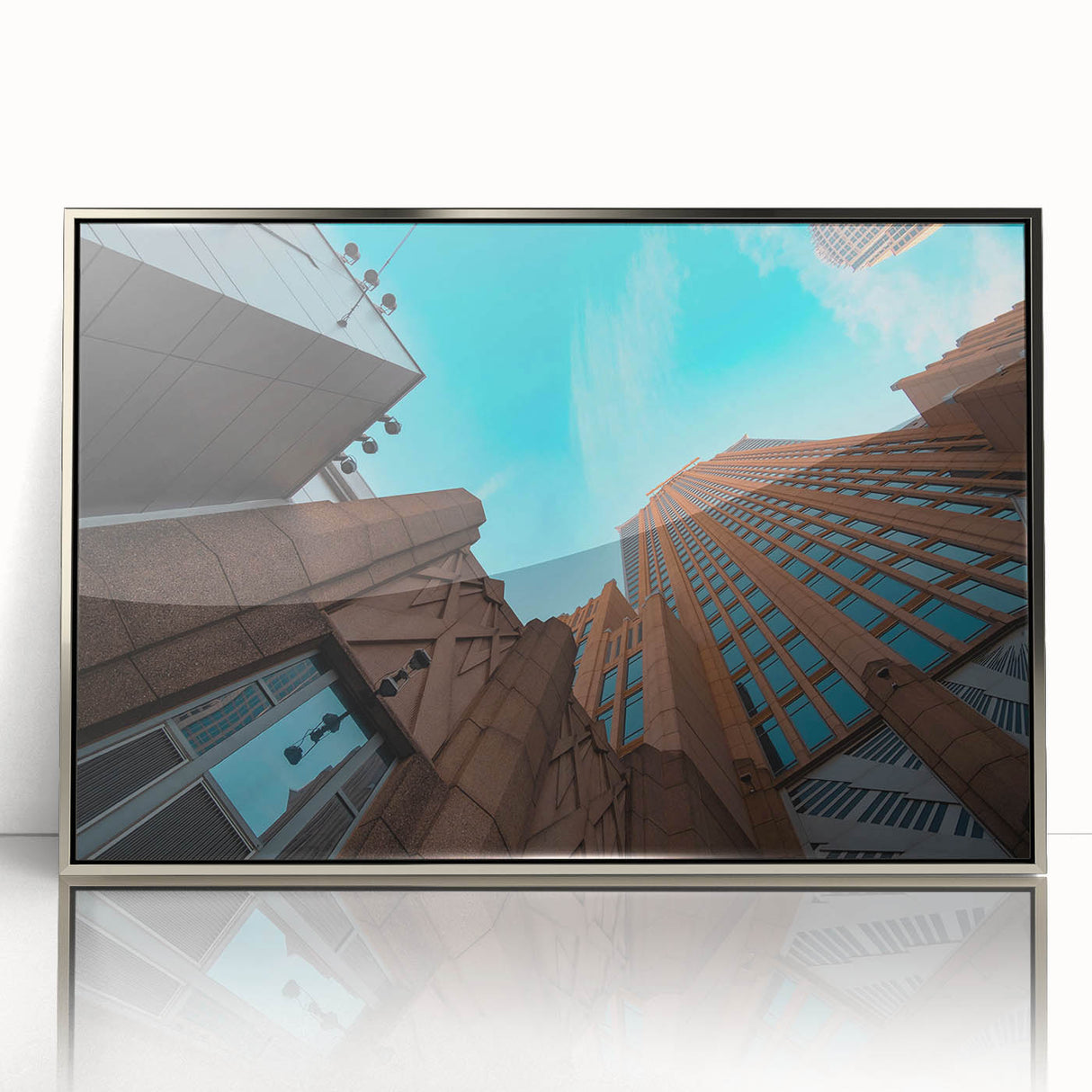 Mid-century modernist art depicting the Charlotte skyline in muted silver tones on a framed acrylic print.