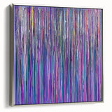 Framed canvas artwork showcasing an abstract floral design in vibrant colors, featuring a sleek silver frame that enhances its modern aesthetic, perfect for home decor.