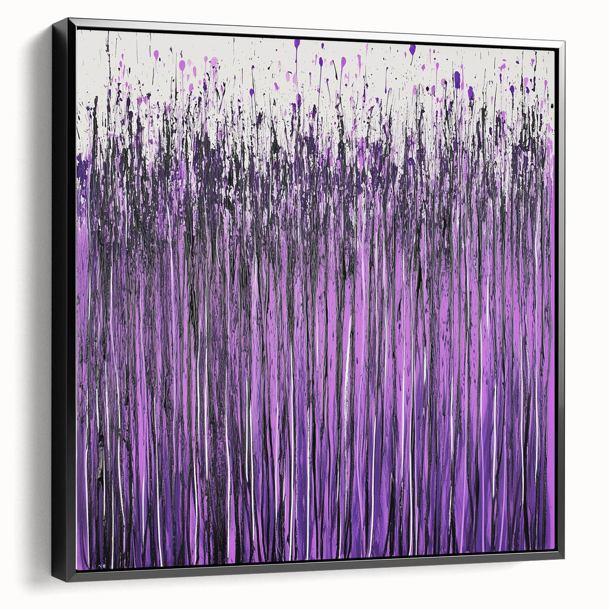 Framed canvas artwork showcasing vibrant abstract floral designs in shades of blue and pink, displayed in a sleek black frame, perfect for modern home decor.